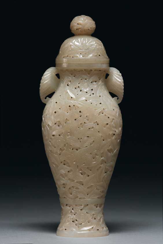 Appraisal: TIBETAN-STYLE JADE VASE Intricately openwork carved Tibetan-style reticulated white jade