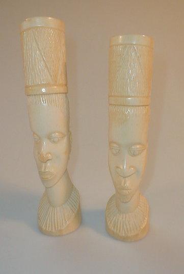 Appraisal: A pair of early thC ivory tusk vases carved with