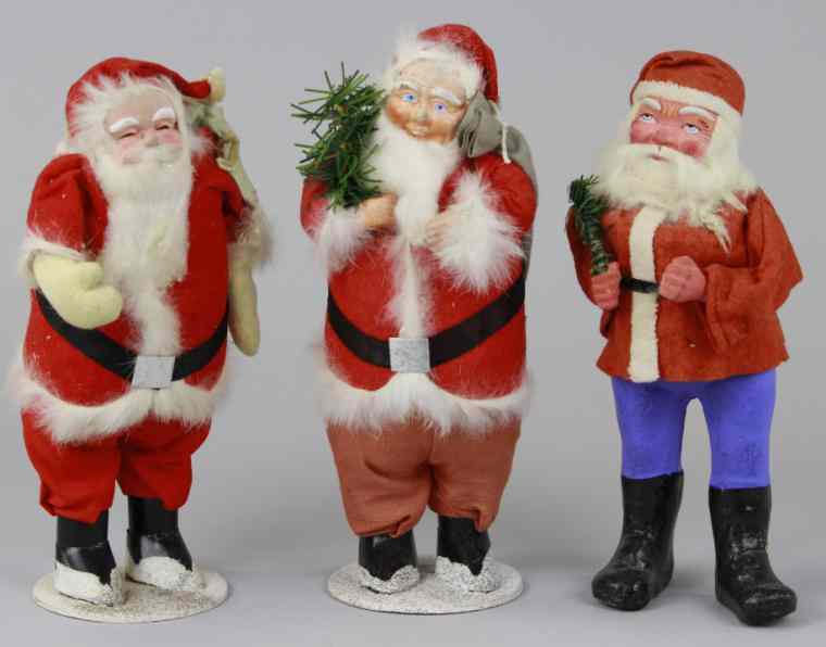 Appraisal: GERMAN SANTA CANDY CONTAINER TWO SANTAS German Santa in red