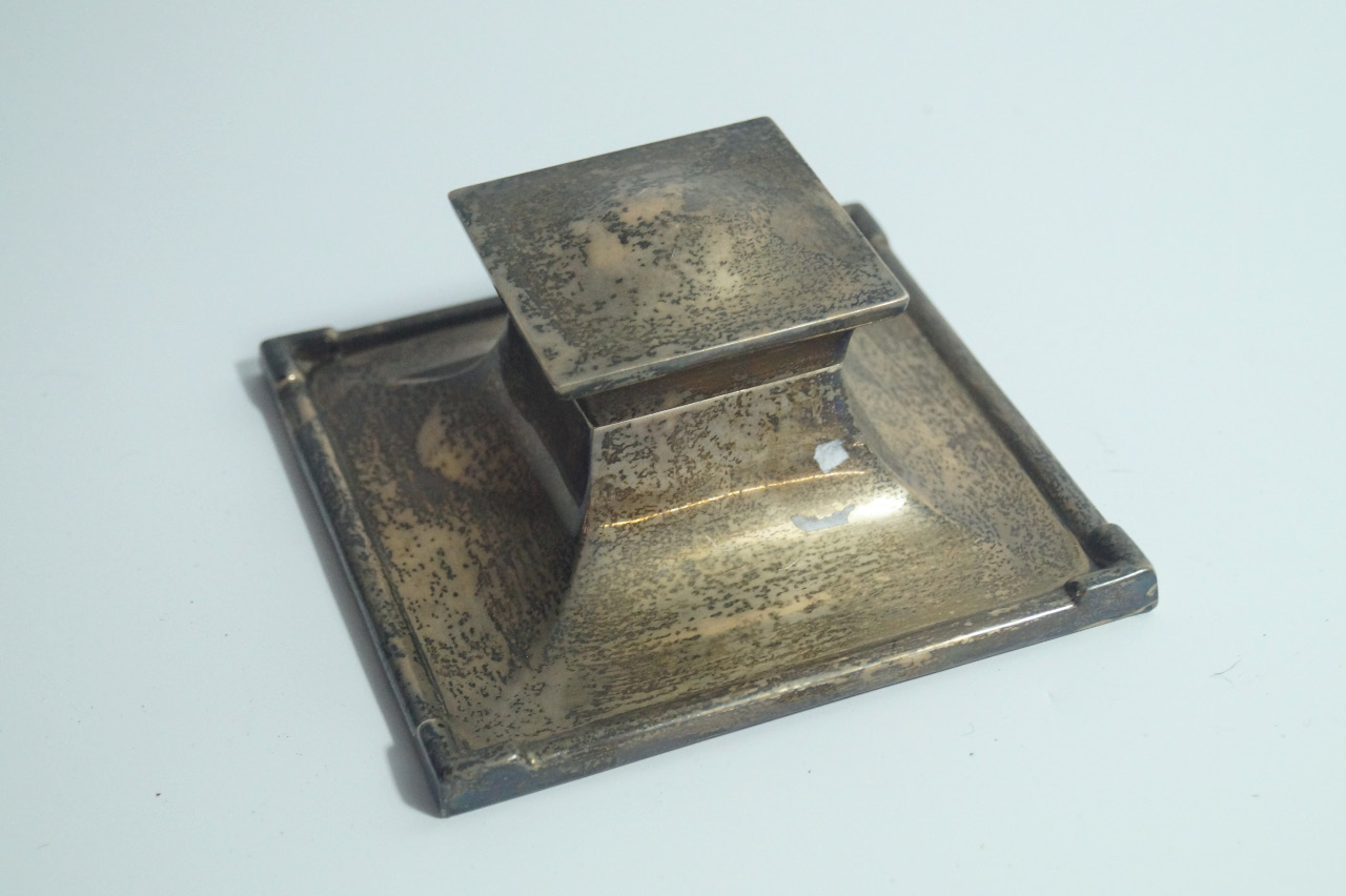 Appraisal: A George VI silver capstan inkwell of square form Birmingham