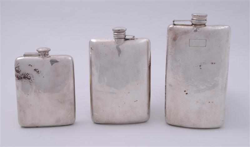 Appraisal: THREE AMERICAN SILVER HIP FLASKS WITH SCREW-ON LIDS Comprising an