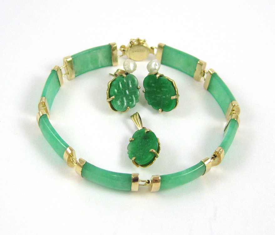 Appraisal: FOUR-PIECE CHINESE JADE AND YELLOW GOLD JEWELRY GROUP green jade