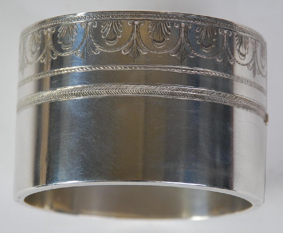 Appraisal: BROAD CONTINENTAL UNMARKED SILVER HINGE OPENING BANGLE with one engraved