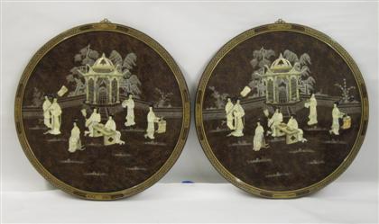 Appraisal: Two Chinese wall hangingsEach of circular form with applied figural