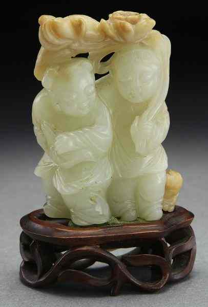 Appraisal: Chinese Qing jade carving depicting He-He er Xianwith a puppy