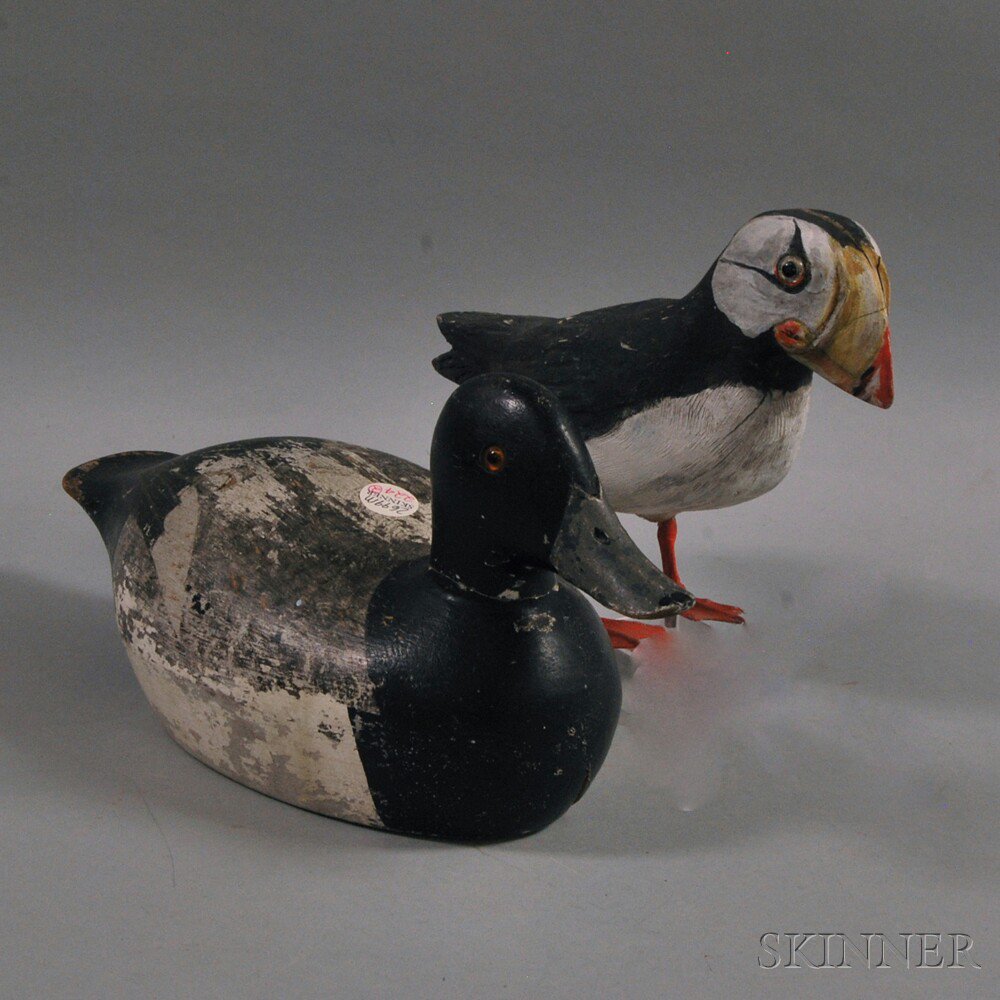 Appraisal: Two Painted Wooden Decoys a duck with black and white