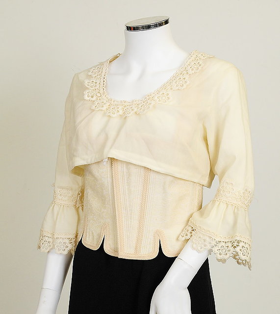 Appraisal: An unusual two piece top by Edith Moden cream structured