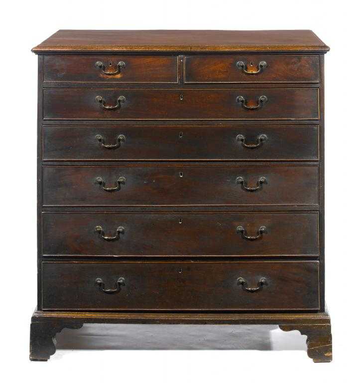 Appraisal: A GEORGE III MAHOGANY CHEST OF DRAWERS fitted two short