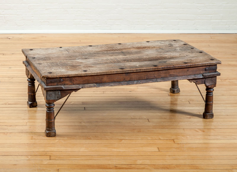 Appraisal: INDIAN TEAK AND WROUGHT IRON LOW TABLE in x ft