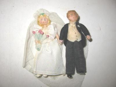 Appraisal: A miniature pair of Grecon bride and groom dolls with