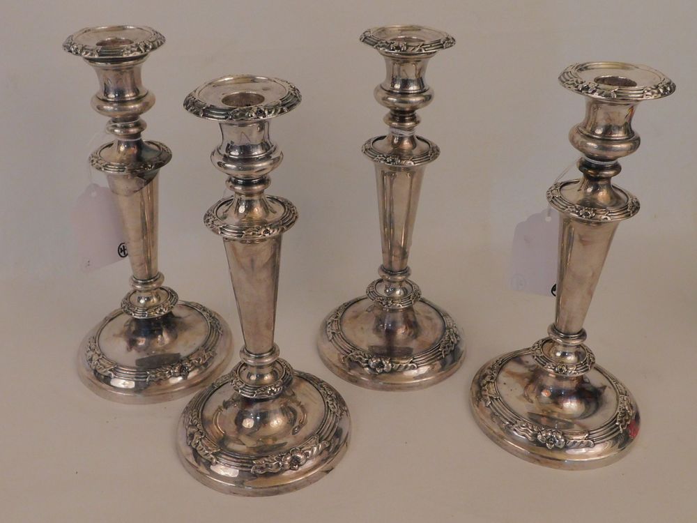 Appraisal: SET ANTIQUE SILVER CANDLESTICKS Set floral repousse th century sterling