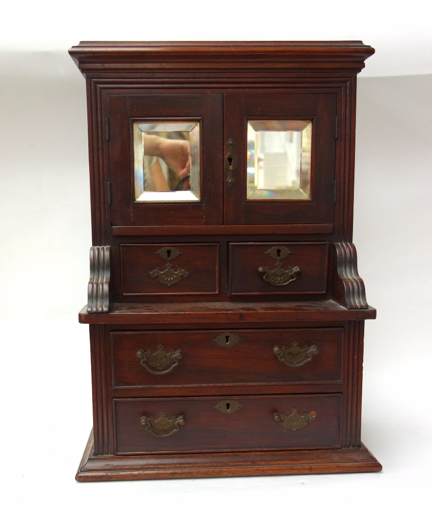 Appraisal: An early th century oak miniature dresser with pair of