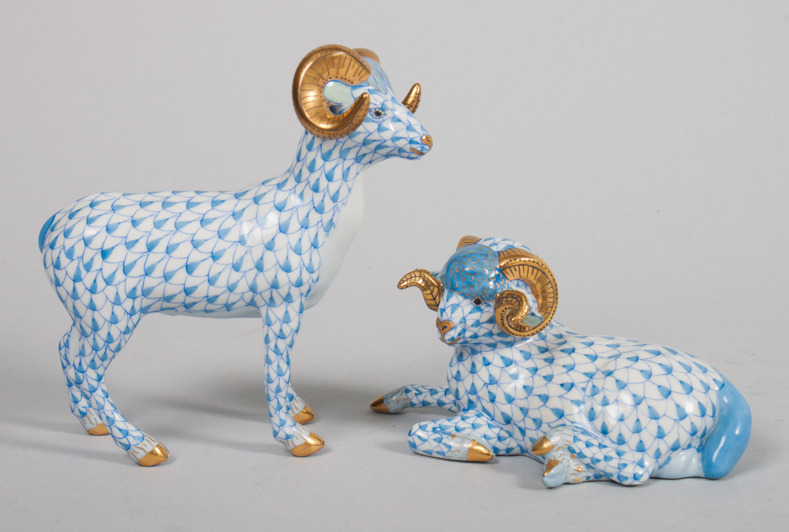 Appraisal: Herend porcelain ram and ewe in the Blue Fishnet pattern