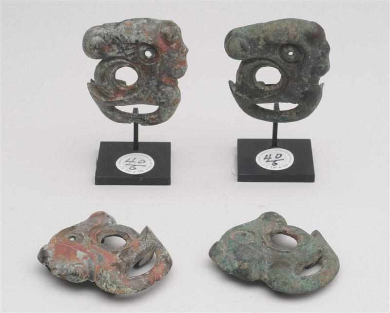 Appraisal: TWO PAIRS OF WESTERN ZHOU ARCHAIC BRONZE FITTINGS Modeled as