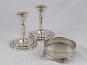 Appraisal: A pair of silver Art Deco candlesticks Birmingham ht cm