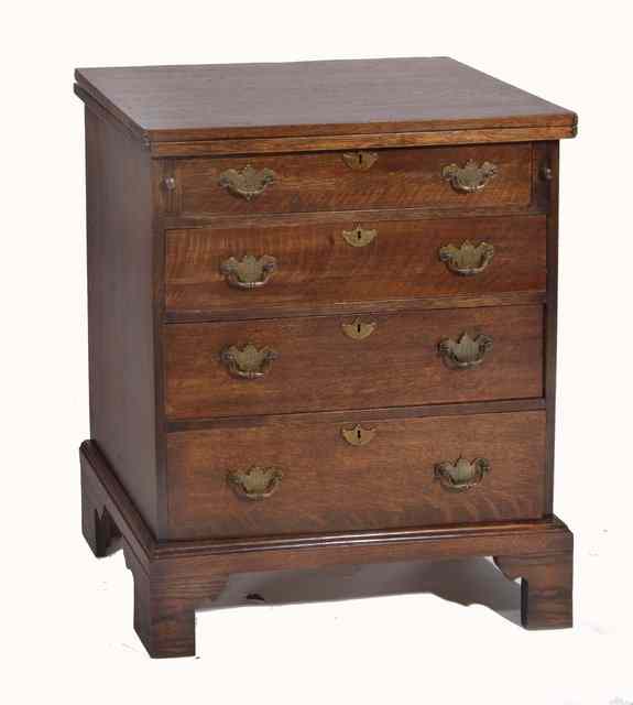 Appraisal: AN OAK GEORGIAN STYLE BACHELORS CHEST with fold over top