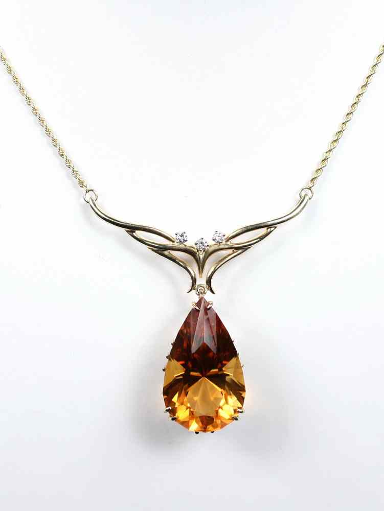 Appraisal: PENDANT - K yellow gold citrine and diamond pendant set