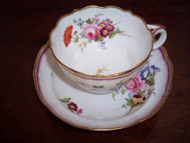 Appraisal: A Chamberlain's Worcester tea cup and saucer painted floral sprays