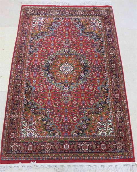 Appraisal: HAND KNOTTED ORIENTAL AREA RUG Indo-Persian floral and central floral