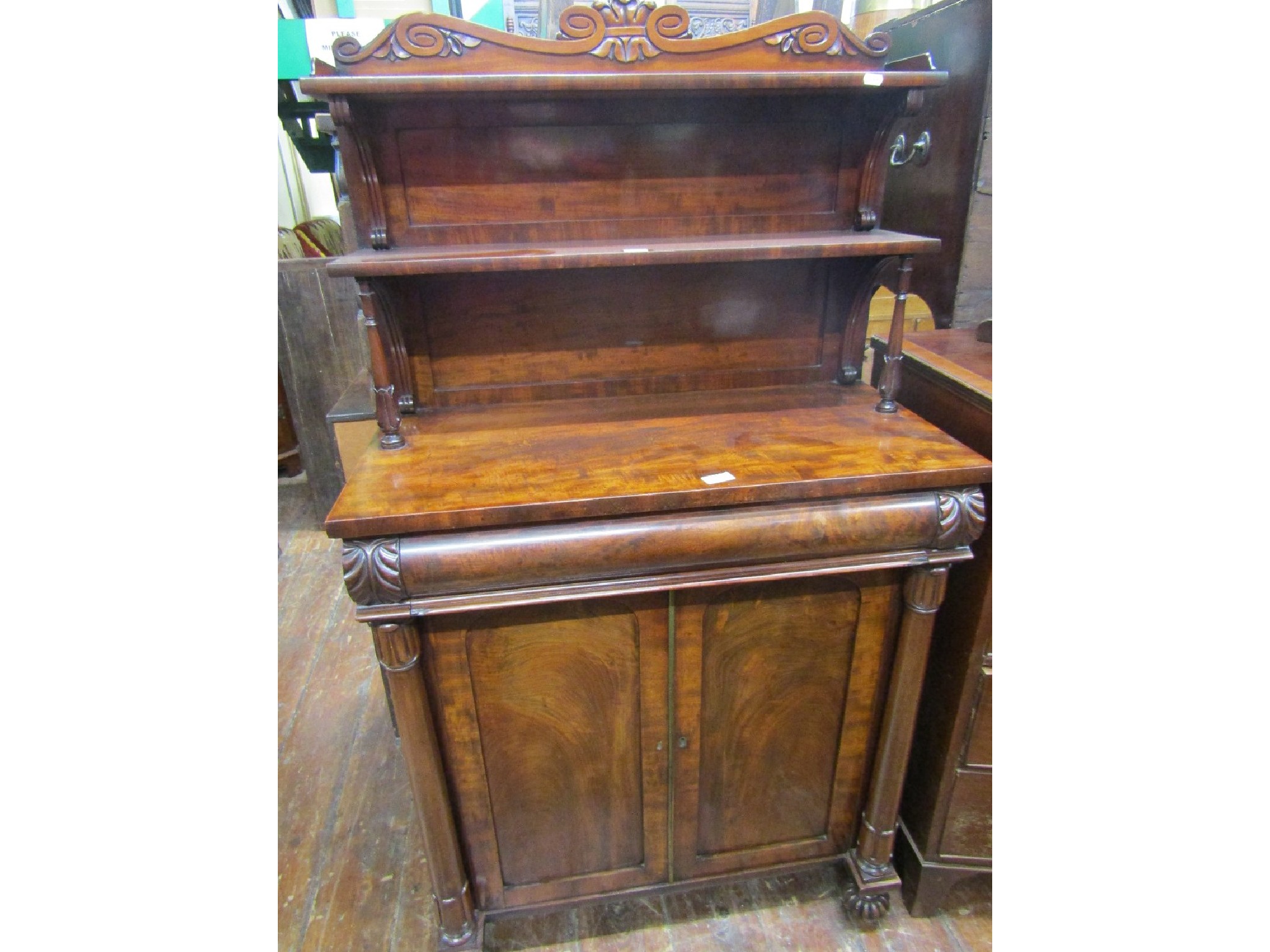 Appraisal: A small Regency mahogany chiffonier the lower section enclosed by