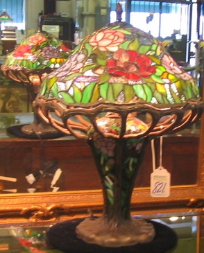 Appraisal: A TIFFANY STYLE STAINED AND LEADED GLASS TABLE LAMP The