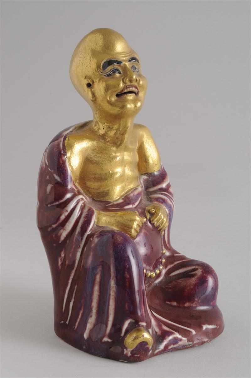 Appraisal: CHINESE GILT AND FLAMB -GLAZED PORCELAIN FIGURE OF A SEATED