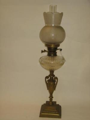 Appraisal: A VICTORIAN BRASS TABLE LAMP the urn shaped support on