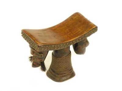 Appraisal: A South African headrest with a central column and curved