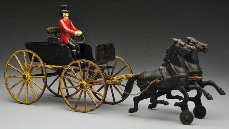 Appraisal: Cast Iron Wilkins Surrey Horse-Drawn Toy Description American Includes correct