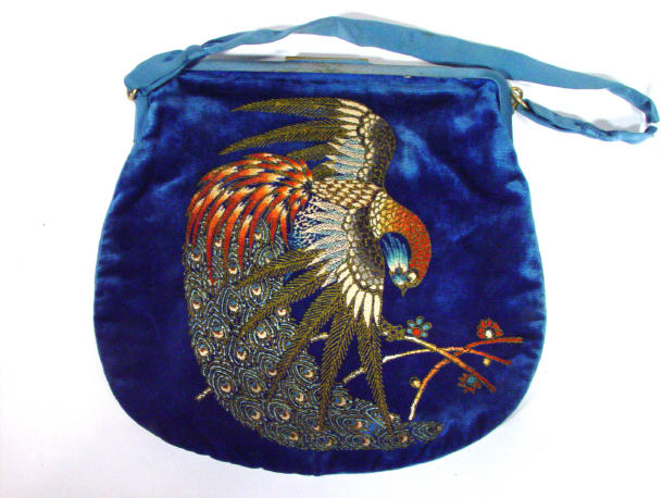 Appraisal: Blue velvet clutch bag embroidered with a peacock cm high