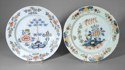 Appraisal: Two similar Delft chargers both with central floral and sprig