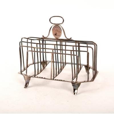 Appraisal: A George III provincial silver toast rack John Hampston John