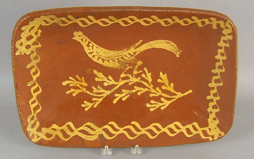 Appraisal: Redware loaf dish th c with yellow slip bird h