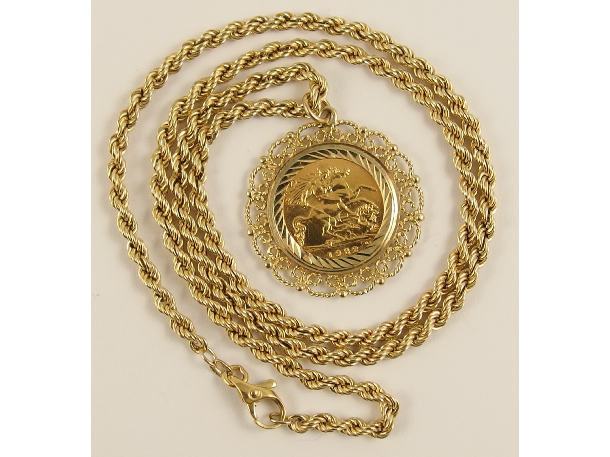 Appraisal: A gold half sovereign in fancy ct pendant mount with