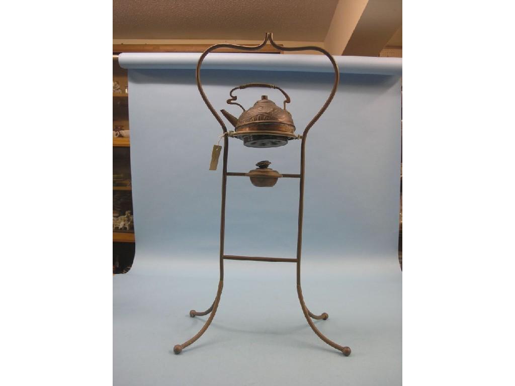 Appraisal: An Art Nouveau copper kettle embossed with stylised devices on