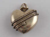 Appraisal: A white metal marked sterling heart shaped perfume bottle by