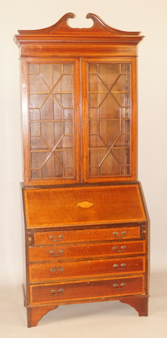 Appraisal: An Edwardian mahogany satinwood bureau bookcase the glazed top with