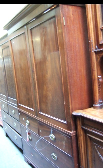 Appraisal: A late George III mahogany linen press the plain cornice