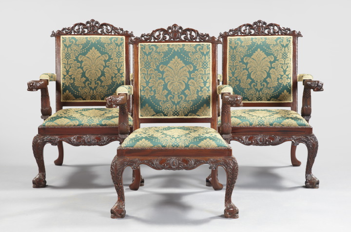 Appraisal: Suite of Three English Exuberantly Carved Mahogany Armchairs each with