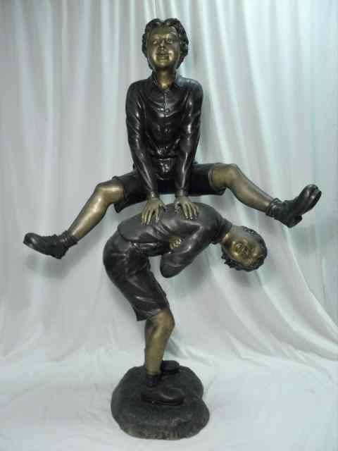 Appraisal: Bronze cast sculpture depicting two boys playing leap frog Condition