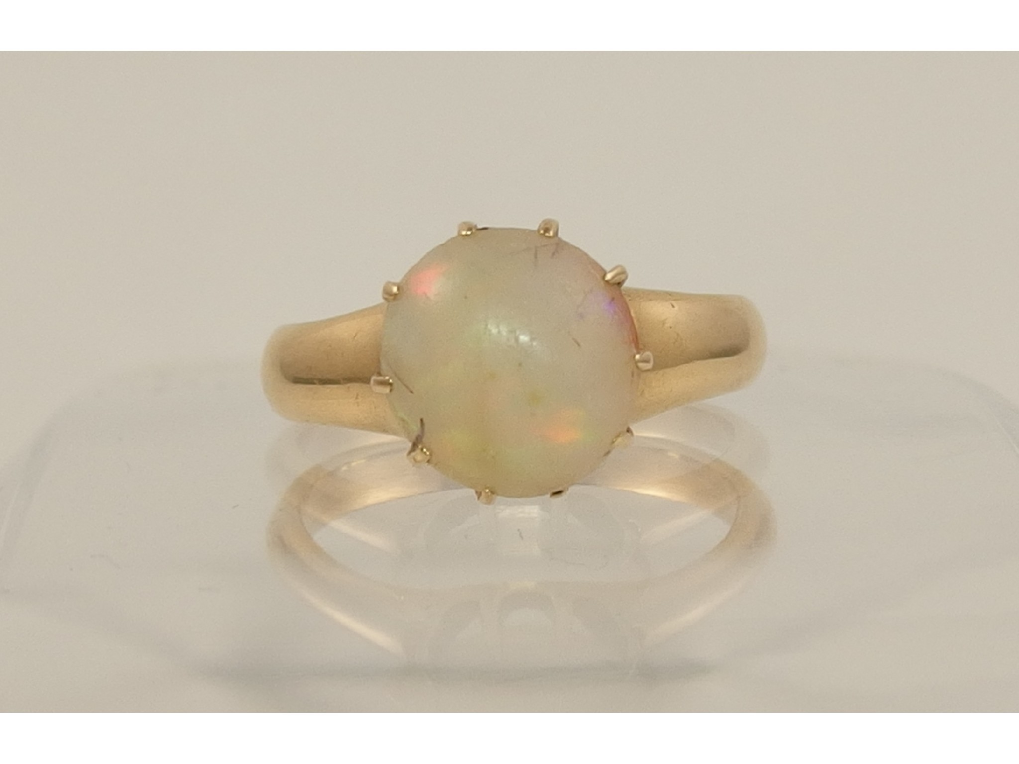 Appraisal: A yellow metal ring set with an opal cabouchon