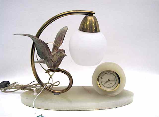 Appraisal: AN AMERICAN ART NOUVEAU STYLE FIGURAL BIRD CLOCK The onyx