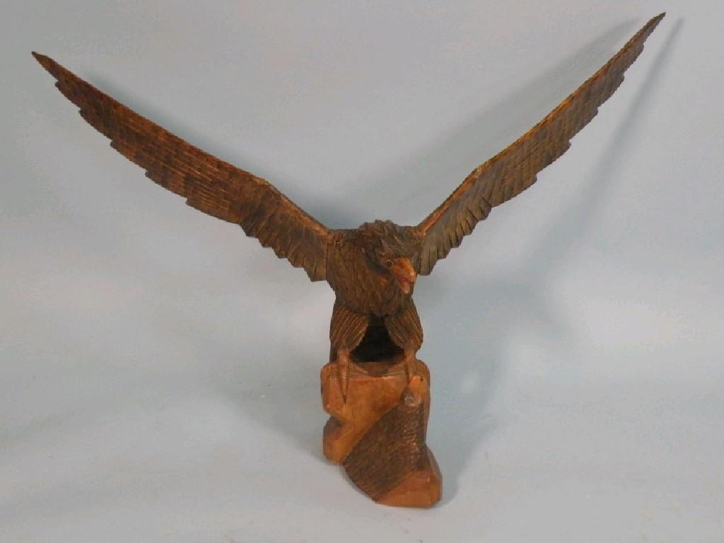 Appraisal: A carved pine Russian eagle and chick seated on a