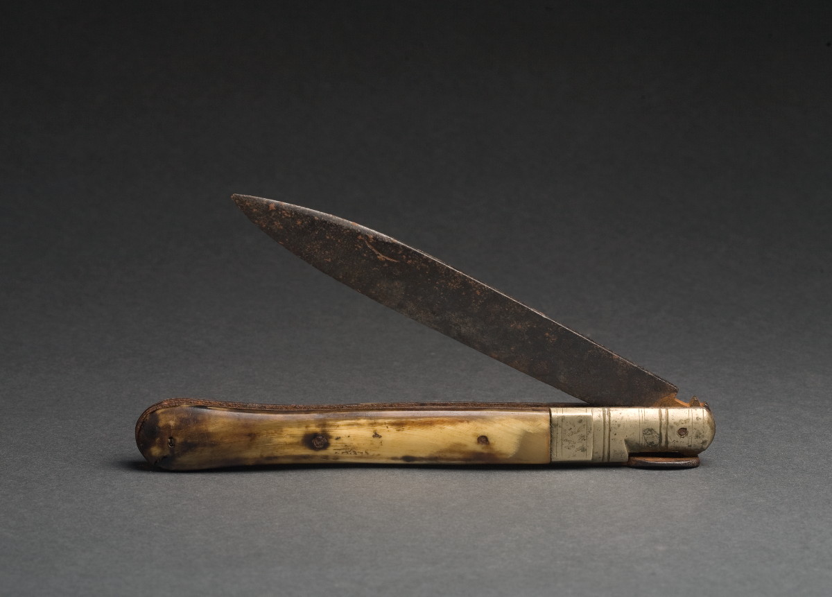 Appraisal: SAILOR'S BONE HANDLED KNIFE The unmarked locking blade with brass