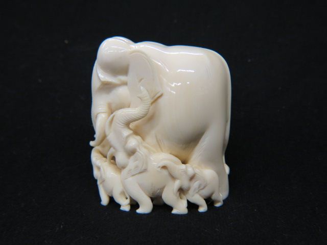 Appraisal: Carved Ivory Figurine of Elephants large central elephant small examples