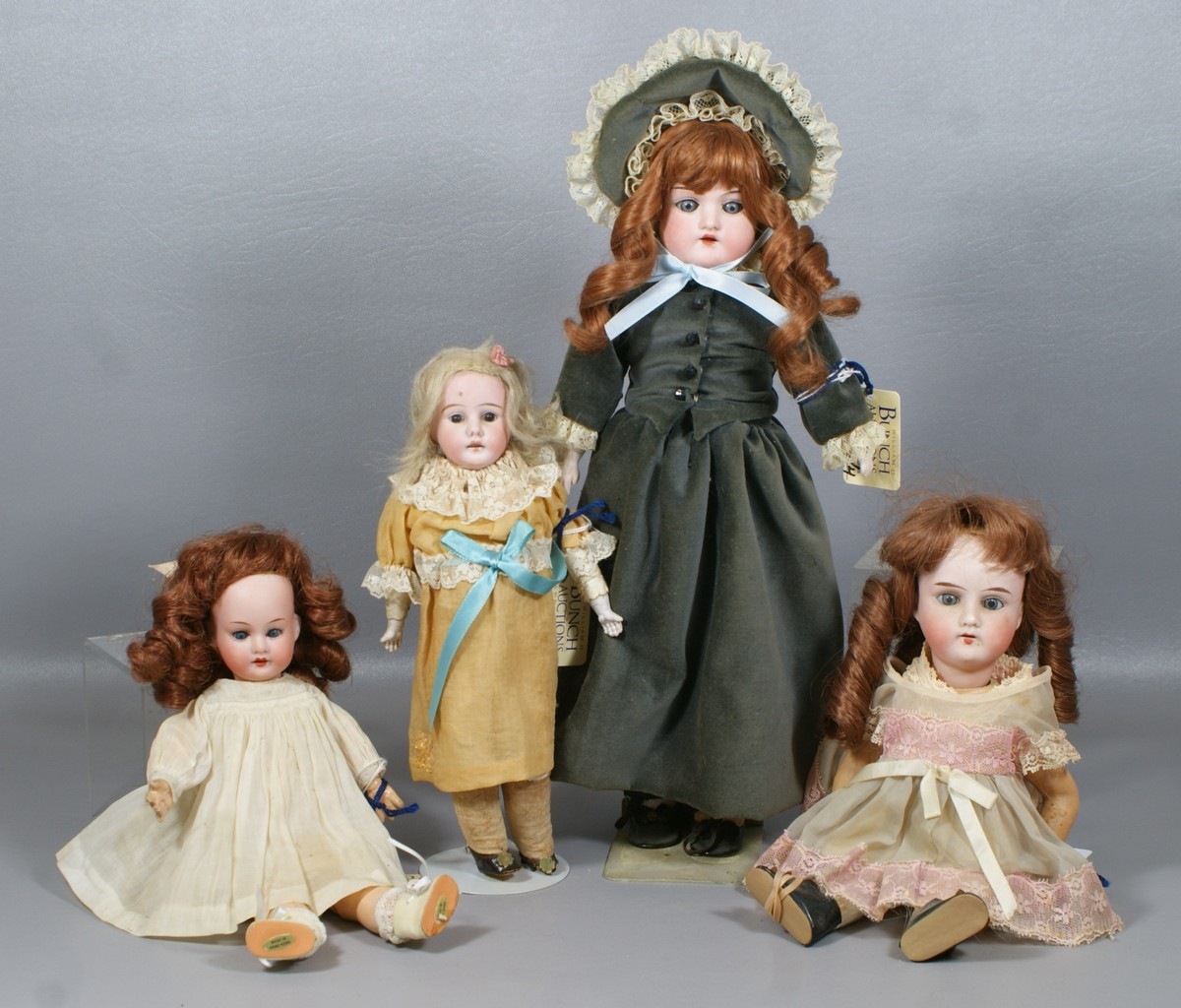 Appraisal: German Bisque Head Dolls including shoulder head dolls and socket