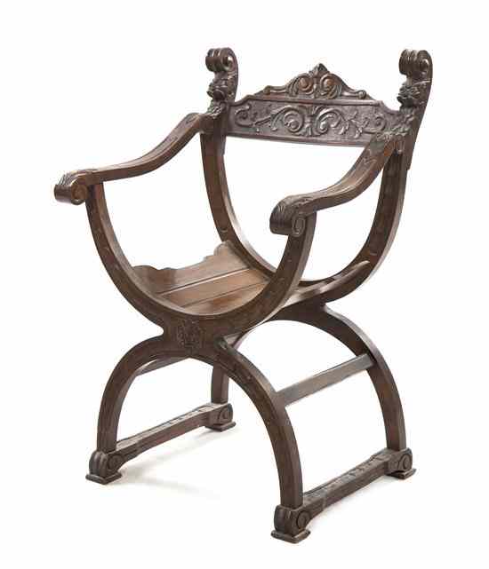 Appraisal: A Curule Form Savonarola Mahogany Chair having mask and carved