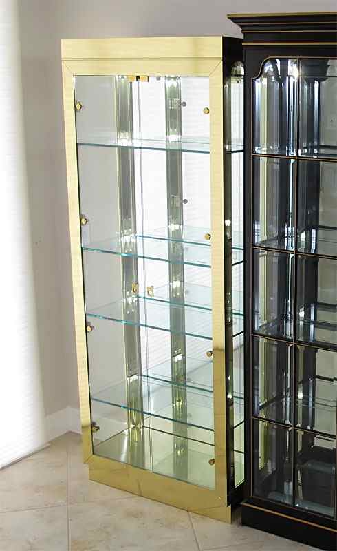 Appraisal: UPRIGHT GLASS CURIO DISPLAY CABINET Gold tone frame with plenty