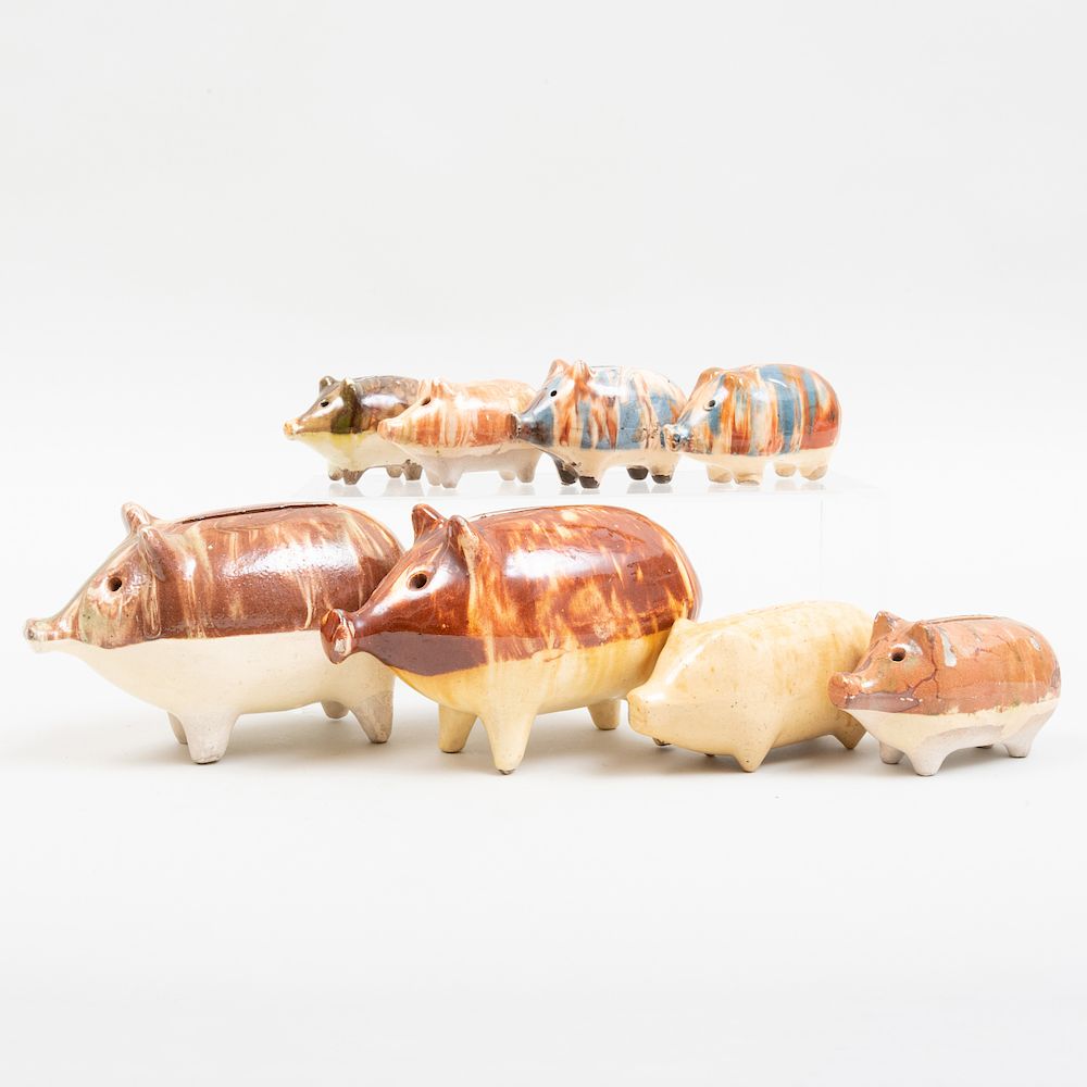 Appraisal: Group of Eight Glazed Pottery Piggy Banks The largest in