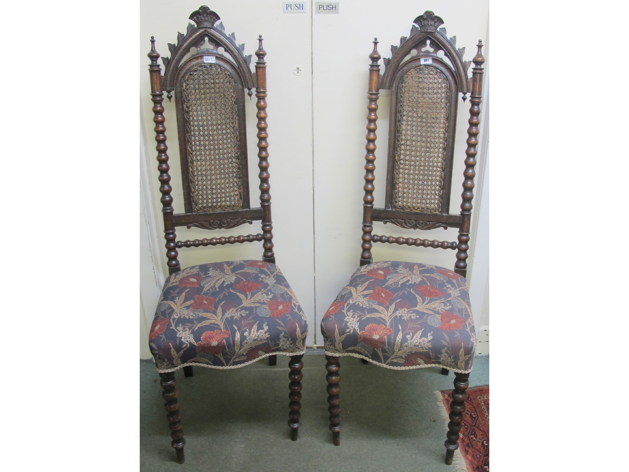 Appraisal: A pair of Victorian oak hall chairs with bobbin supports